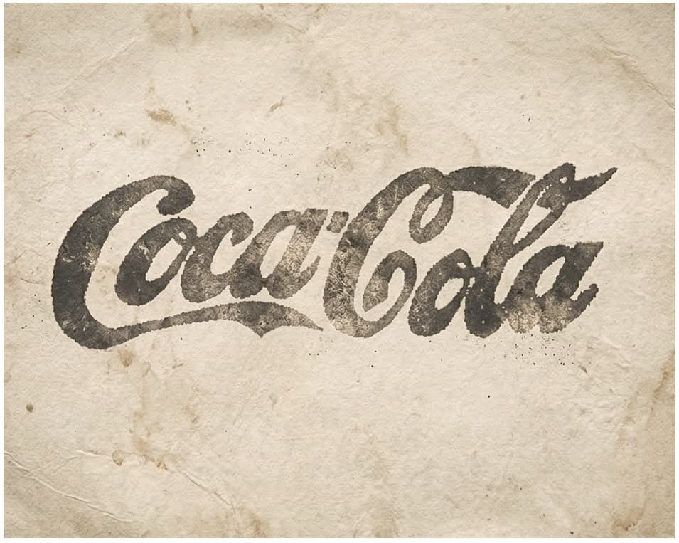 Vintage aged Coca-Cola script logo on old paper